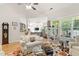 Cozy living room with hardwood floors, a large window, and comfortable seating at 181 Fawn Hill Ct, Garner, NC 27529