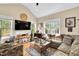 Comfortable living room with a large window and plush seating area, creating a bright and inviting space at 181 Fawn Hill Ct, Garner, NC 27529