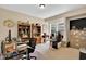 Spacious office space with built-in shelving and natural light from a large window at 181 Fawn Hill Ct, Garner, NC 27529