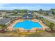 An aerial view of a community pool, surrounded by lounge chairs and a black metal fence at 181 Fawn Hill Ct, Garner, NC 27529