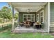 Comfortable covered porch with plenty of seating and decor at 181 Fawn Hill Ct, Garner, NC 27529