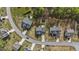Aerial view of a home with a fenced backyard featuring a playground, deck, and patio set at 189 Grey Hawk Dr, Garner, NC 27529