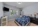 Comfortable bedroom with a TV, window, and neutral decor at 189 Grey Hawk Dr, Garner, NC 27529