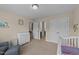 The Bedroom features a crib, changing table, and lots of natural light at 189 Grey Hawk Dr, Garner, NC 27529