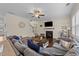 Comfortable living room with a cozy fireplace, modern decor, and hardwood floors at 189 Grey Hawk Dr, Garner, NC 27529