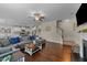 Inviting living room featuring hardwood floors, fireplace, and access to the kitchen at 189 Grey Hawk Dr, Garner, NC 27529