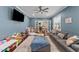 Bright play room with plenty of space for activities, toys, and a cozy sofa at 189 Grey Hawk Dr, Garner, NC 27529