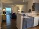 Open kitchen view into the living room, featuring modern appliances and hardwood floors at 1911 Wolftech Ln # 204, Raleigh, NC 27603