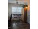 Bright sunroom with a decorative wrought iron table and two matching stools at 1911 Wolftech Ln # 204, Raleigh, NC 27603