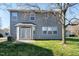Back exterior view of house, showing patio and grassy backyard at 192 Solheim Ln, Raleigh, NC 27603