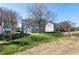 Fenced backyard features mature trees, a swing set, and community walking path at 192 Solheim Ln, Raleigh, NC 27603