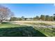 Backyard view of mature landscaping and community golf course and walking paths at 192 Solheim Ln, Raleigh, NC 27603