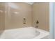 Clean bathtub with a modern faucet and neutral-colored tile surround at 192 Solheim Ln, Raleigh, NC 27603