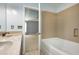 Bright bathroom with a tub and view into the main bedroom at 192 Solheim Ln, Raleigh, NC 27603