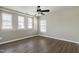 Modern bedroom with laminate flooring, lots of natural light, and a ceiling fan at 192 Solheim Ln, Raleigh, NC 27603