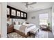 Stylish bedroom with a black accent wall, neutral decor, a cozy chair, and ample natural light at 192 Solheim Ln, Raleigh, NC 27603