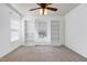 Cozy bedroom with white trim and built-in bookcases and natural light at 192 Solheim Ln, Raleigh, NC 27603