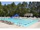 Large community pool with lounge chairs, slide, and tables creating a perfect spot for summer relaxation at 192 Solheim Ln, Raleigh, NC 27603