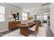 Open dining room with hardwood floors, modern decor, a large table with seating for six, and natural light at 192 Solheim Ln, Raleigh, NC 27603