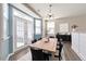 Bright dining area with french doors, a modern light fixture, and a table with seating for six at 192 Solheim Ln, Raleigh, NC 27603
