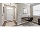 Inviting entryway with a white front door, side table, art, and natural light from a window at 192 Solheim Ln, Raleigh, NC 27603
