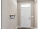 Cozy foyer featuring a convenient key rack and a well-lit entrance at 192 Solheim Ln, Raleigh, NC 27603