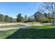 Scenic golf course view featuring walking path, fairways, and mature trees at 192 Solheim Ln, Raleigh, NC 27603