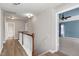Second floor hallway with hardwood floors, staircase and views to the bedrooms and bathroom at 192 Solheim Ln, Raleigh, NC 27603