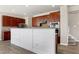 Kitchen island with white shiplap and dark wood cabinets, perfect for entertaining and everyday living at 192 Solheim Ln, Raleigh, NC 27603