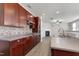 Open kitchen features wood cabinets, countertops, stainless steel appliances and view to the living room at 192 Solheim Ln, Raleigh, NC 27603