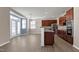 Bright kitchen featuring wooden cabinetry, stainless steel appliances, and a view to the dining area at 192 Solheim Ln, Raleigh, NC 27603
