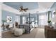 Serene main bedroom features a canopy bed, soft blue walls, and ample natural light from large windows at 192 Solheim Ln, Raleigh, NC 27603
