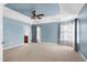 Spacious bedroom featuring a ceiling fan, carpeted floor, and a light blue color scheme at 192 Solheim Ln, Raleigh, NC 27603