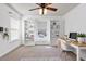 Bright home office with built-in shelving, a large window, hardwood floors, and a modern desk setup at 192 Solheim Ln, Raleigh, NC 27603
