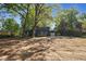 This exterior view highlights the home's deck and garage, plus the backyard with a basketball hoop at 204 N Gurney St, Burlington, NC 27215