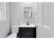 Modern bathroom featuring a sleek vanity with a black cabinet and matte black fixtures at 204 N Gurney St, Burlington, NC 27215