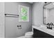 This modern bathroom is designed with a sleek vanity, contemporary fixtures, and a bright window at 204 N Gurney St, Burlington, NC 27215