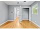 Bright bedroom with hardwood floors, closet, and doorway view into the hallway at 204 N Gurney St, Burlington, NC 27215