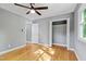 This cozy bedroom offers hardwood floors, modern ceiling fan, and a closet for ample storage at 204 N Gurney St, Burlington, NC 27215