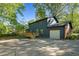Charming two-story home with a new deck, attached garage, and a spacious driveway at 204 N Gurney St, Burlington, NC 27215
