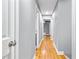 Bright hallway with hardwood floors and neutral walls leading to additional rooms at 204 N Gurney St, Burlington, NC 27215