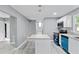Well-lit kitchen with an island, modern appliances, and sleek countertops that create an elegant space at 204 N Gurney St, Burlington, NC 27215