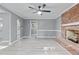 Open living room features a brick fireplace and seamless flow to the kitchen, perfect for Gathering gatherings at 204 N Gurney St, Burlington, NC 27215