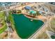 Overhead view of the community amenities including a lake, pool, clubhouse, and playground at 221 Douglas Falls Dr, Wendell, NC 27591