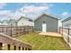 Fenced backyard featuring a wooden deck and tidy lawn at 221 Douglas Falls Dr, Wendell, NC 27591