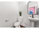Powder room features a pedestal sink, modern fixtures, and a neutral color scheme at 221 Douglas Falls Dr, Wendell, NC 27591