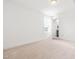 Bright bedroom with neutral carpet, a window, and an open doorway at 221 Douglas Falls Dr, Wendell, NC 27591