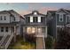 Charming two-story home featuring a welcoming front porch, landscaped yard, and classic architectural details at 221 Douglas Falls Dr, Wendell, NC 27591