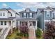 Charming two-story home features a welcoming front porch and well-maintained landscaping at 221 Douglas Falls Dr, Wendell, NC 27591