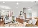 Bright living room with white walls, hardwood floors, and contemporary furnishings at 221 Douglas Falls Dr, Wendell, NC 27591